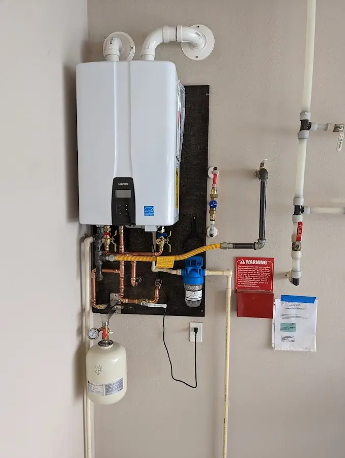 Professional plumber installing copper piping in a Reno home
